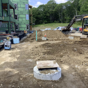 Site work with a focus on a concrete pylon.