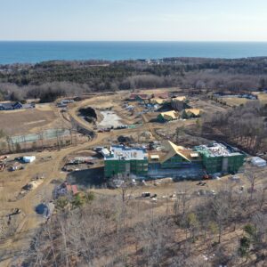 Aerial view of new housing with ocean in the background.