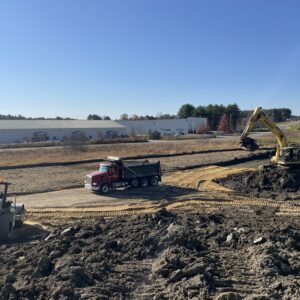 Dump truck featured at site.