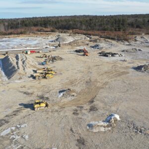 Scattered heavy equipment on a large job site.