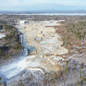 Job site with lakes and mountains in the background.
