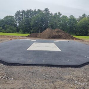 New pad of pavement and concrete.