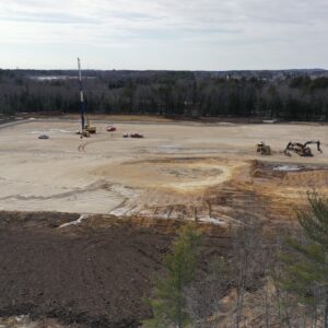 Drone shot of future distribution facility featuring scattered equipment.