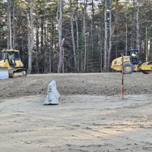 Two construction vehicles on the Mussy Road Apartments work site